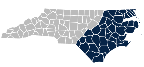 A map of the 100 NC counties with the coastal region outlined in blue.