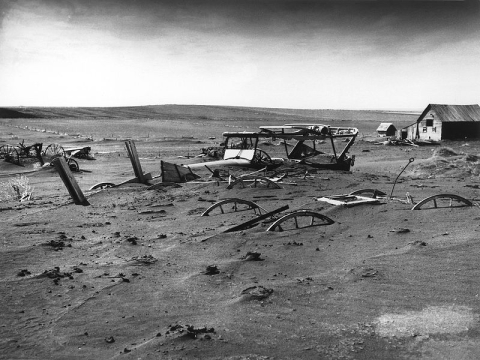 Farm machinery buried in dust storm