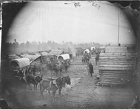 Civil War camp scene showing winter huts and corduroy roads