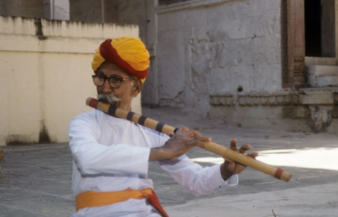 Man playing flute at Mehrangarh Fort in Jodhpur, India