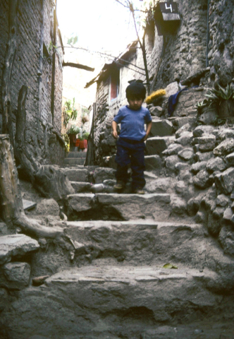 Child walking in an alley in Guanajuato, Mexico