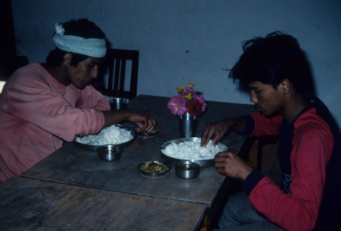 Trekking guides eating at a hotel in Jomsom, Nepal