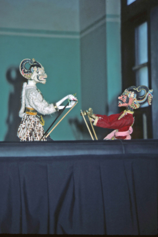 Hanuman and demon king Ravana wooden puppets in battle at Yogyakarta performance