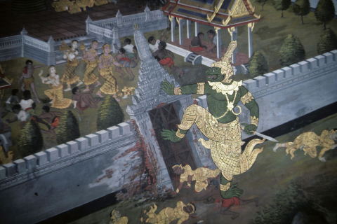 Demon climbs over a walled palace gate (Thai Ramayana mural)