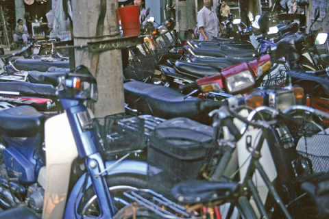 Rows of motorcycles parked in neat lines in Hanoi