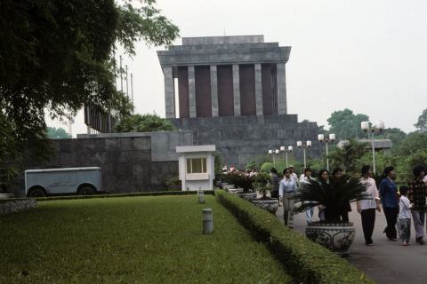 Visitors stroll along a walkway outside Ho Chi Minh's mausoleum in Hanoi